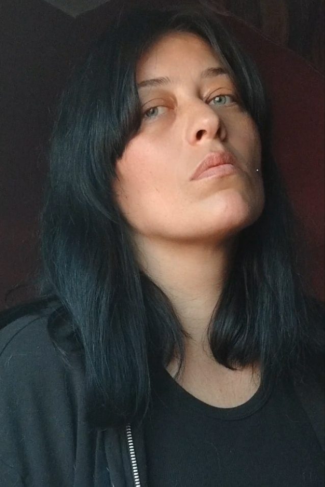 A professional headshot of Grable, a dark-pop artist, with a serious and contemplative expression.